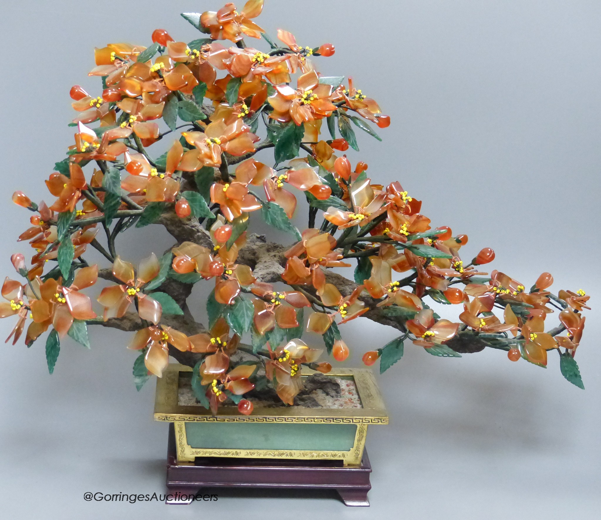 A Chinese hardstone model of a tree and planter height 38cm and five hardstone fruits